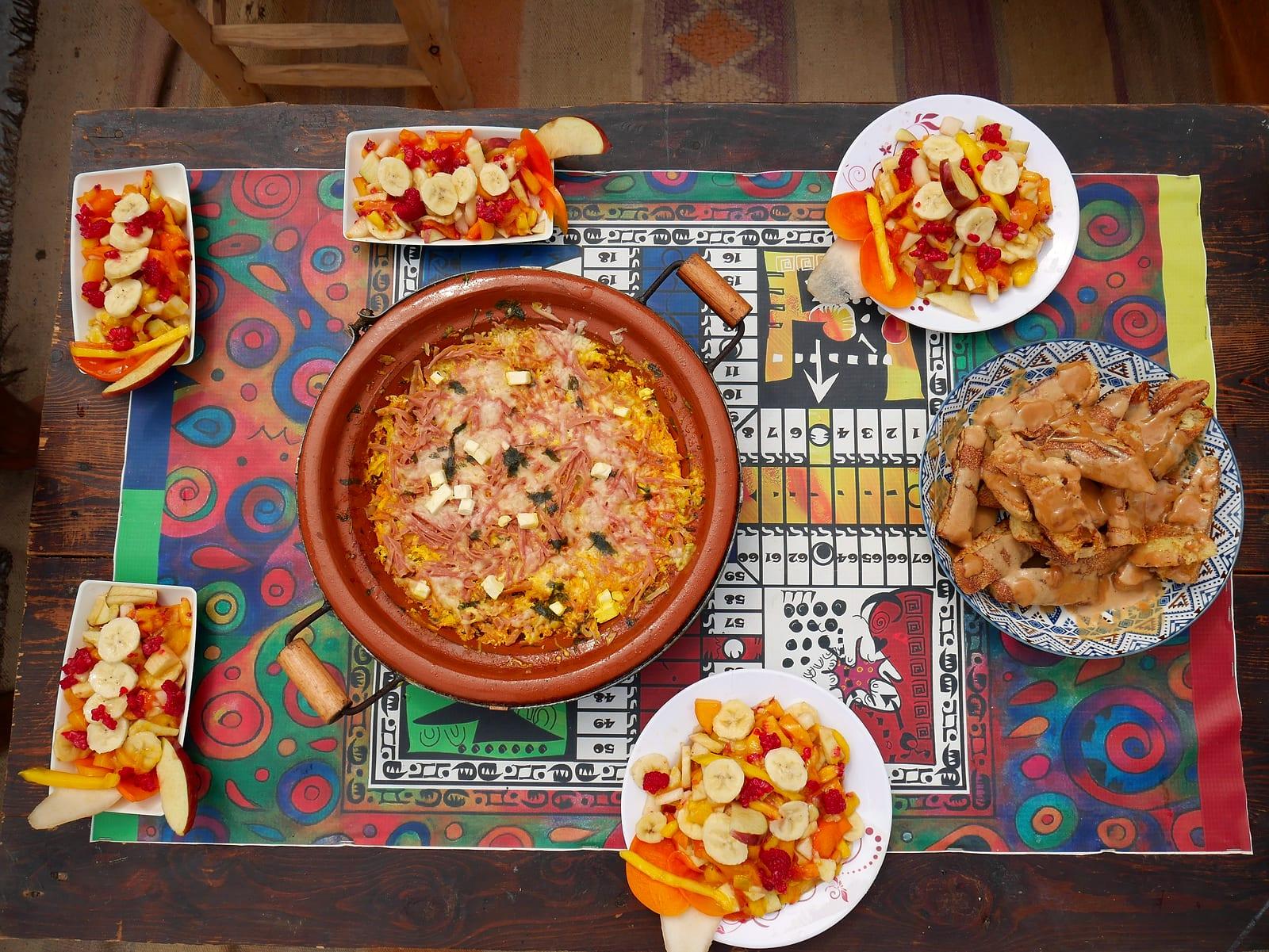 Guests sharing food and games around the big table