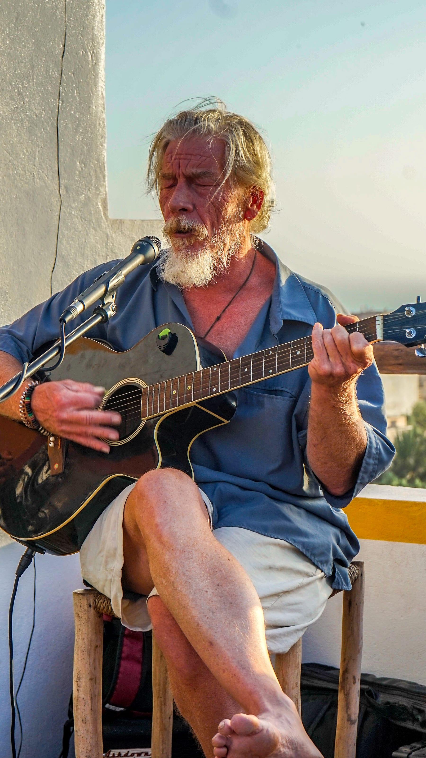 Guitarist in a quiet residency moment